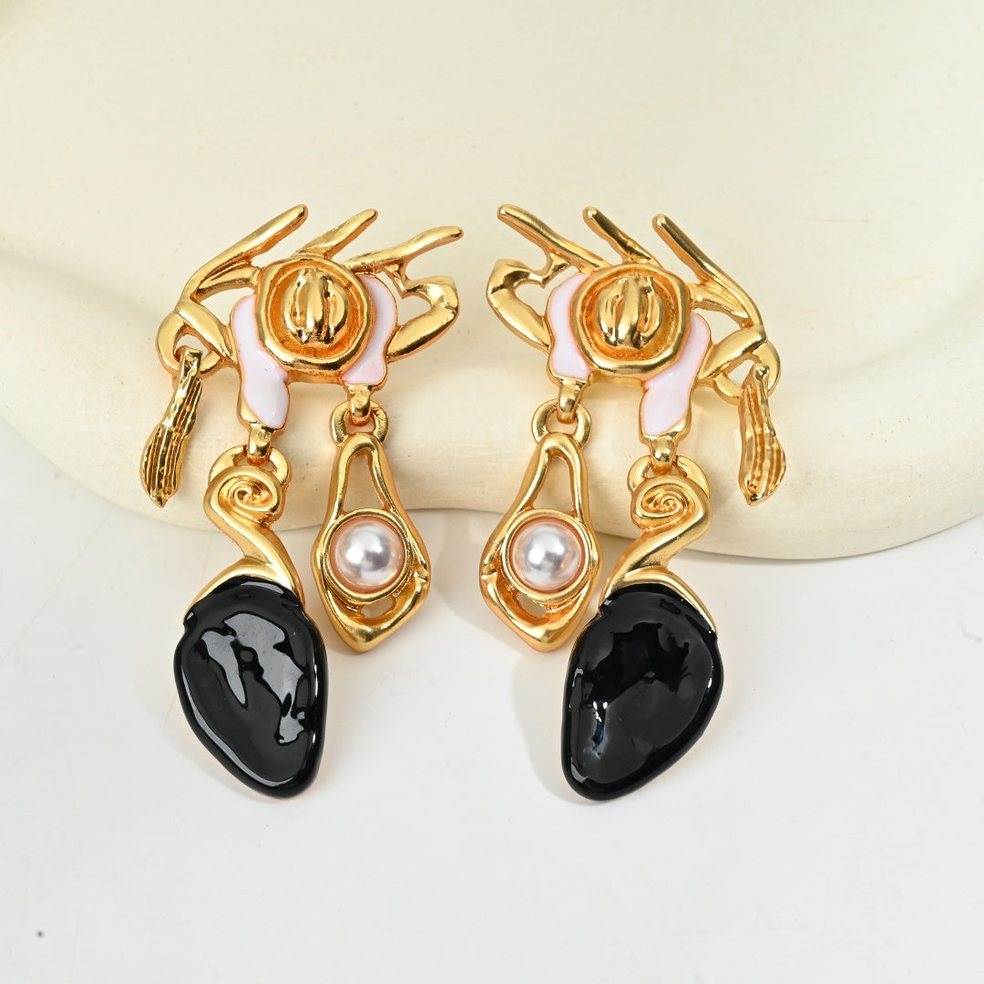 Macro detail of midnight resin drop earring with baroque crown accent, surrealist vintage jewelry by The Civilis