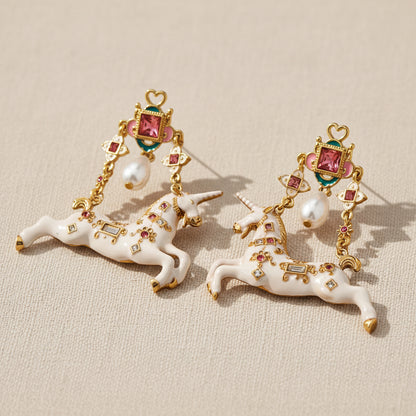 Surrealist Unicorn Dangle Earrings with white enamel and baroque pearl, 18K gold plated, front view