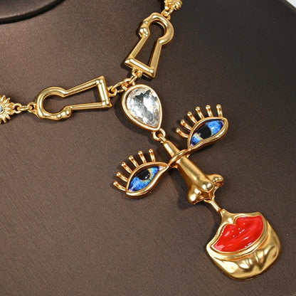 Close-up detail of crimson lip pendant necklace with 18K gold plated chain, surrealist art-inspired jewelry