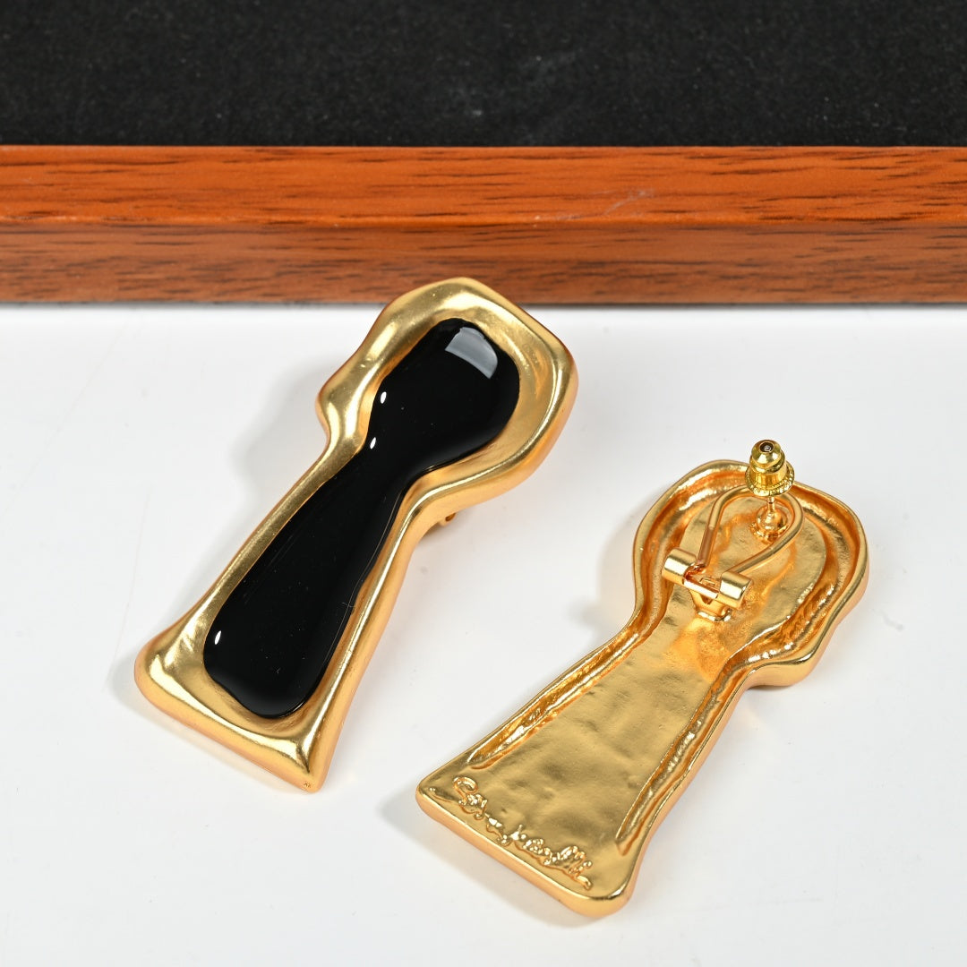 Reverse side of Secret Keyhole black enamel earring showing 925 sterling silver post and brass construction