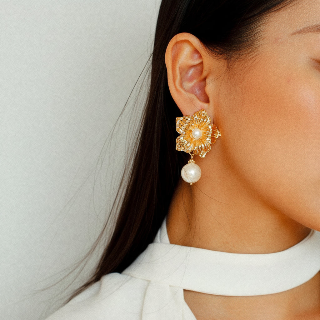 Three-quarter view of model showcasing detailed gold flower and pearl jewelry.