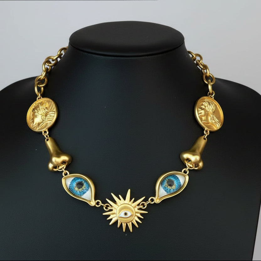 Surrealist Eye & Sun Medallion Necklace on mannequin, showing full length drop