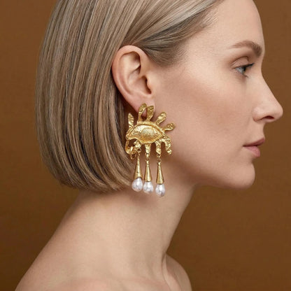 Model wearing Pegasus Winged Horse earrings, gold mythology jewelry, celestial drop studs