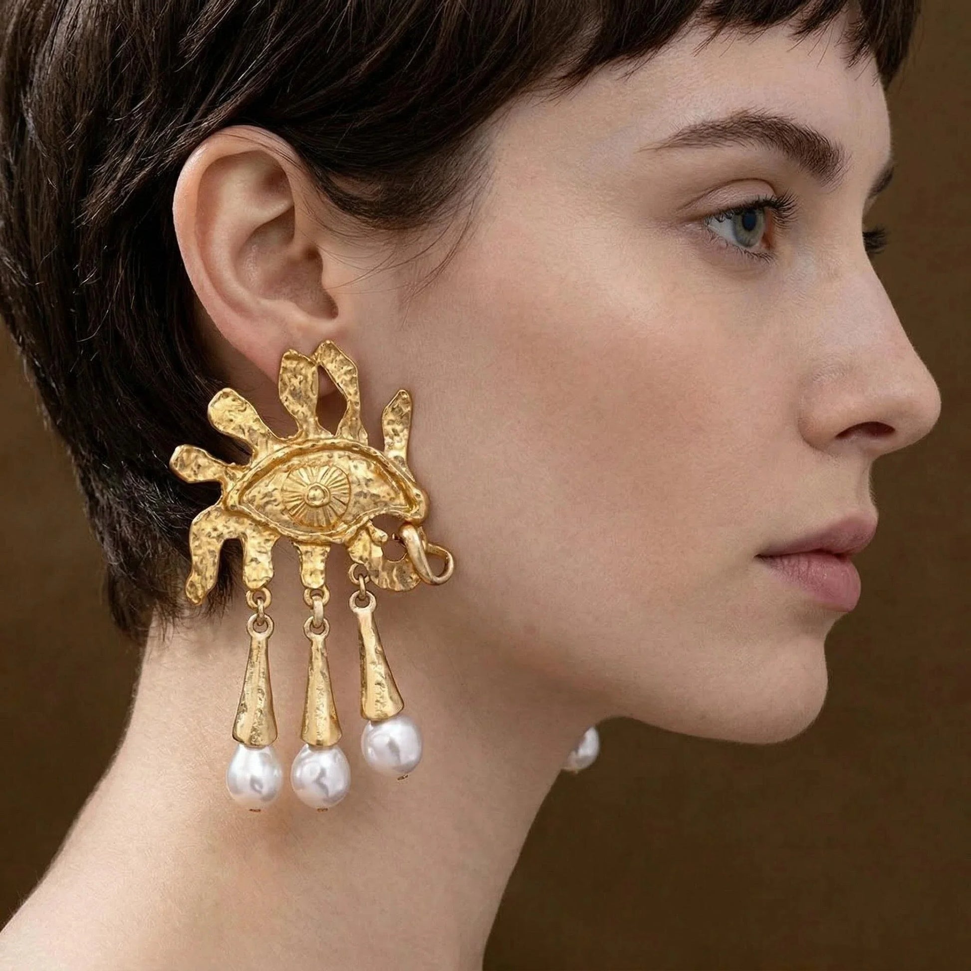 Close-up of model wearing Pegasus Ascent earrings, 18K gold brass and S925 silver, goddess jewelry