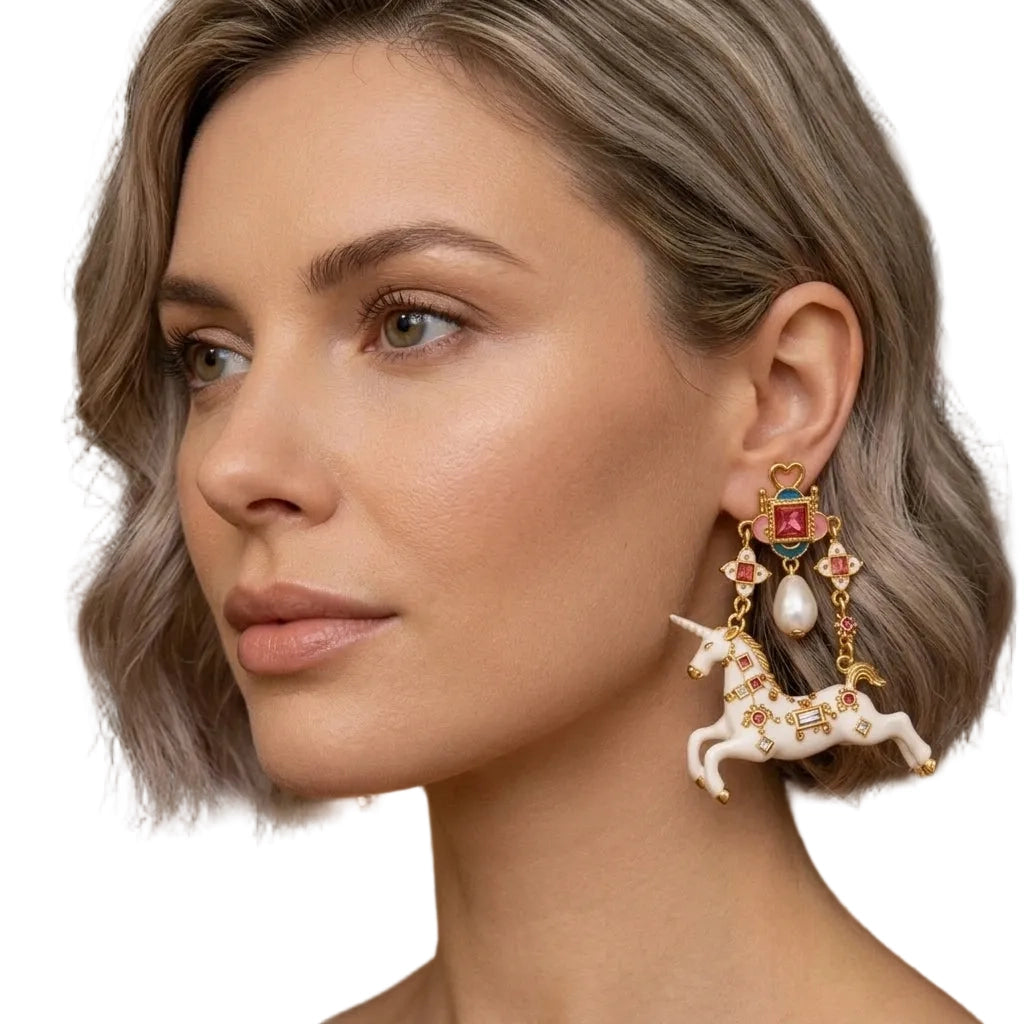 Surrealist unicorn statement earrings on model, showing full length drop