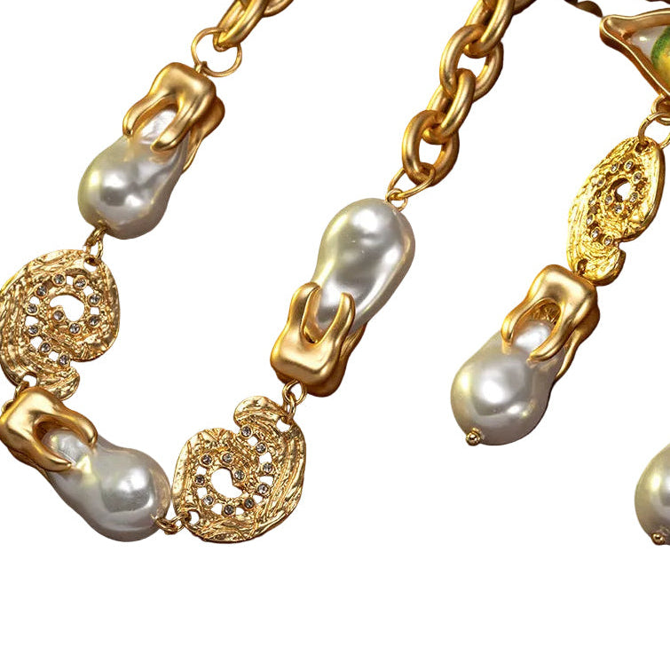 Devil's Eye Gothic Necklace close-up detail, antique gold tone with baroque pearl
