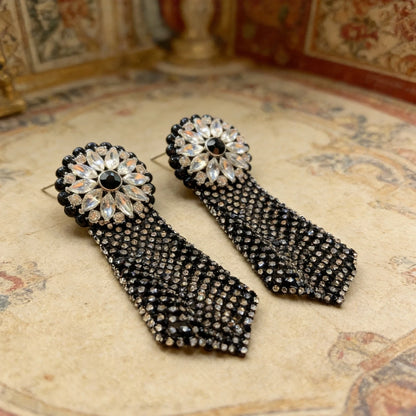 Macro detail of Midnight Dahlia mesh drop earring highlighting crystal embellishments and tassel fringe
