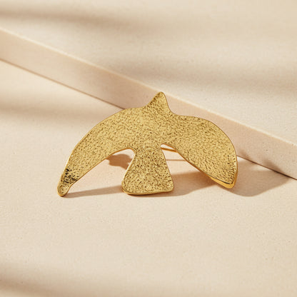 Golden Echoes hammered brass peace dove brooch in 18K gold plated finish with Forever engraving, full product view 

