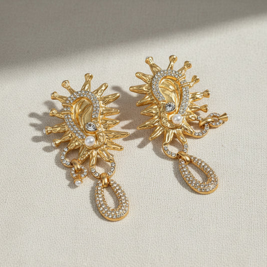 Vintage Sun God crystal earrings lifestyle display shot, surrealist gold jewelry by The Civilis