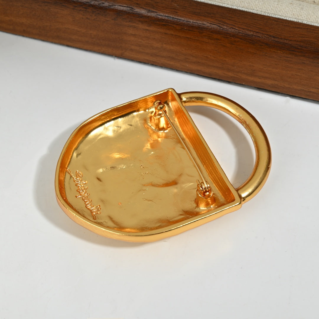 Reverse side detail of 18K gold plated brass lock brooch showing pin clasp mechanism and craftsmanship