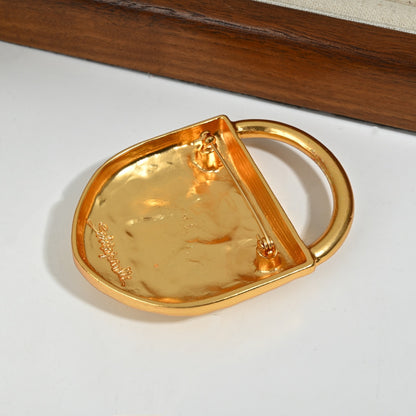 Reverse side detail of 18K gold plated brass lock brooch showing pin clasp mechanism and craftsmanship