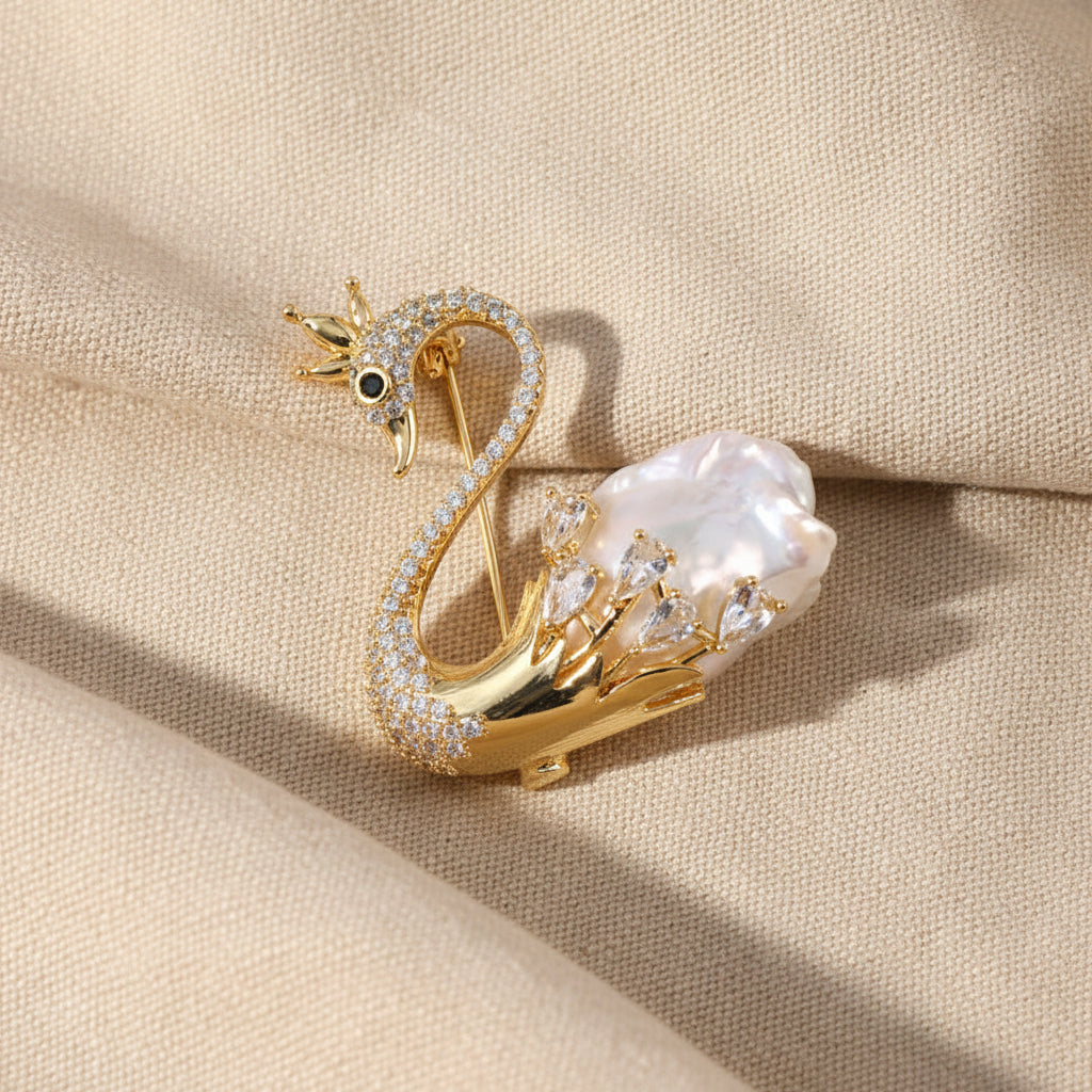 Golden Crowned Swan Brooch with Irregular Baroque Pearl and Crystal Pave Detail.