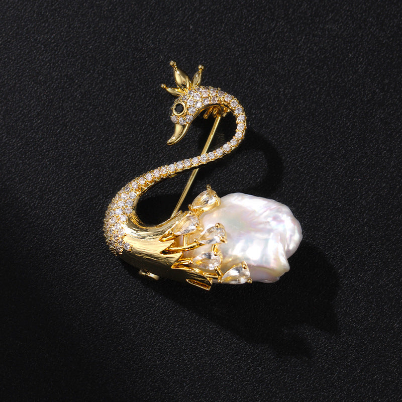 Close-up of Handcrafted Swan Brooch on Black Textured Background for Jewelry Detail.