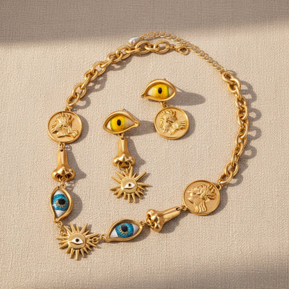 Surrealist Eye & Sun Medallion Jewelry Set full view, necklace and earrings, vintage gold tone