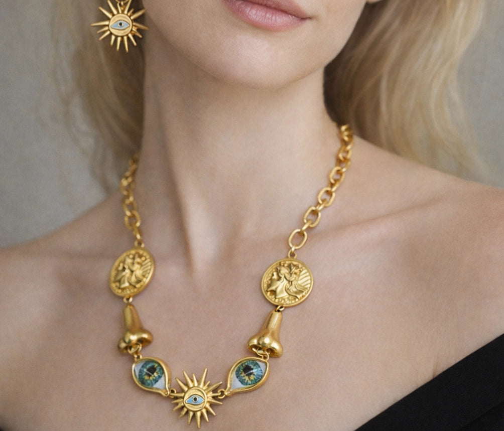 Surrealist Eye & Sun Medallion Jewelry Set worn on model, full styling look