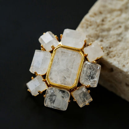 Sculptural geometric crystal pin featuring hand-selected natural quartz stones, modern minimalist jewelry accessory.