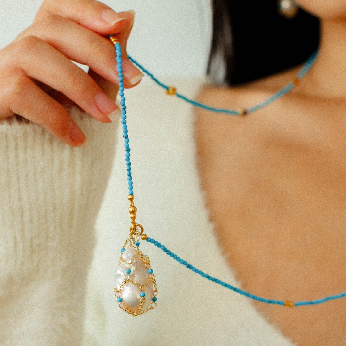 Model wearing artisan baroque pearl turquoise beaded necklace front view 18K gold plated boho chic jewelry

