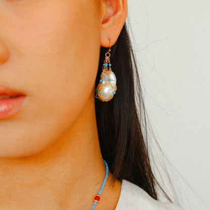  Model side profile wearing baroque pearl and turquoise drop earrings 18K gold plated boho statement earrings

