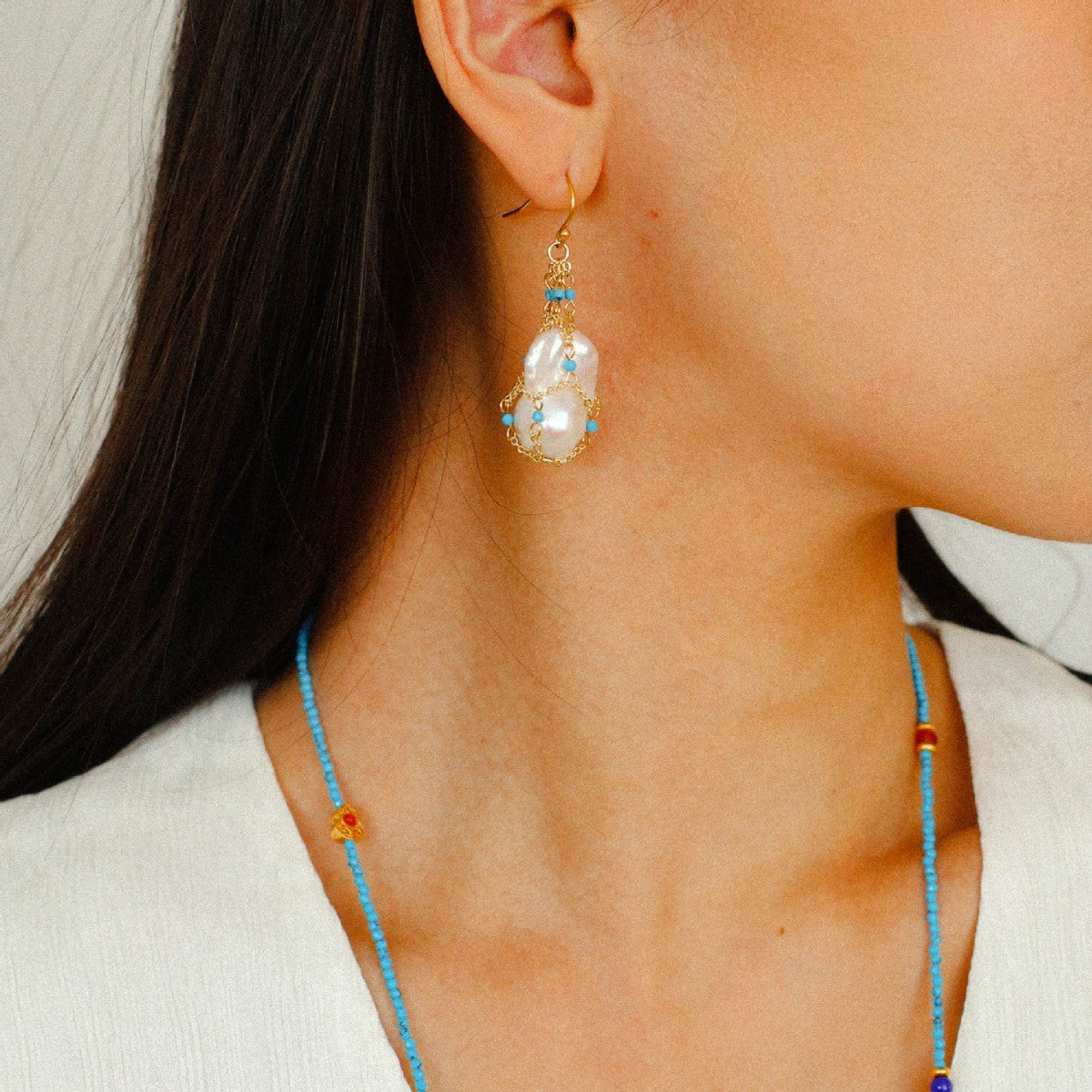 Model side face wearing baroque pearl turquoise earrings 18K gold plated artisan boho chic jewelry

