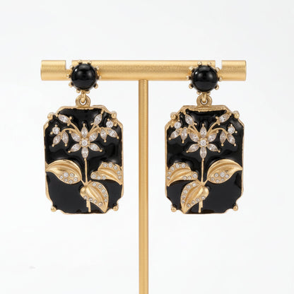 Vintage Chinese Plum Blossom Stud Earrings flat lay on white background