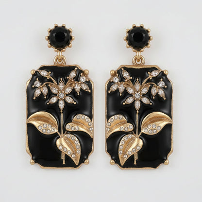 Black Enamel Plum Blossom Earrings close-up detail showing gold petal accents