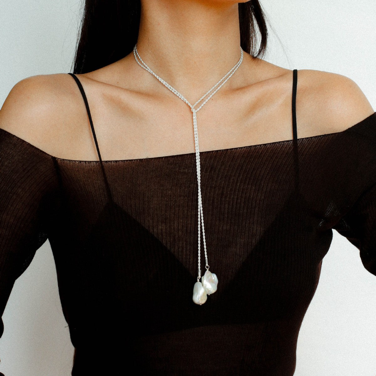  Model wearing long baroque pearl lariat necklace silver version twisted rope chain multi-way wrap necklace

