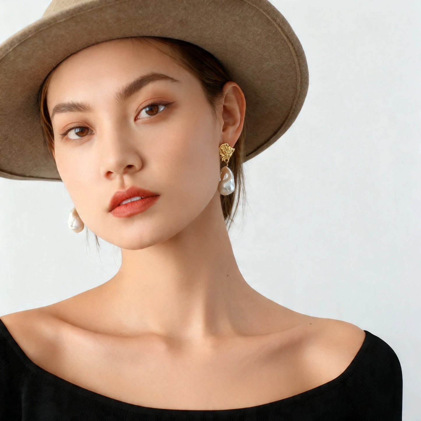 Model wearing molten gold baroque pearl drop earrings front view surrealist statement jewelry 18K gold plated

