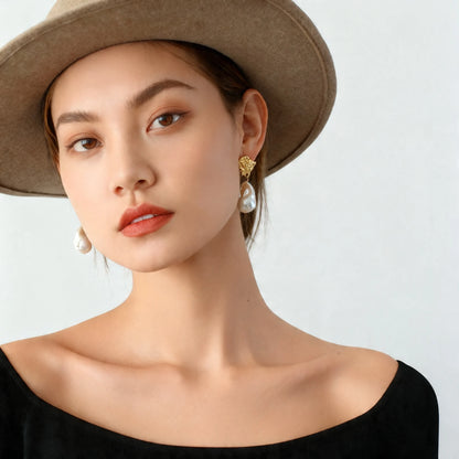 Model wearing molten gold baroque pearl drop earrings front view surrealist statement jewelry 18K gold plated

