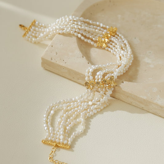 Multi-strand mini freshwater pearl choker full view on beige background 18K gold plated brass vintage layered statement necklace