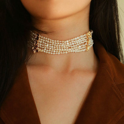Model wearing multi-strand pearl choker front view statement necklace 18K gold plated vintage jewelry for women


