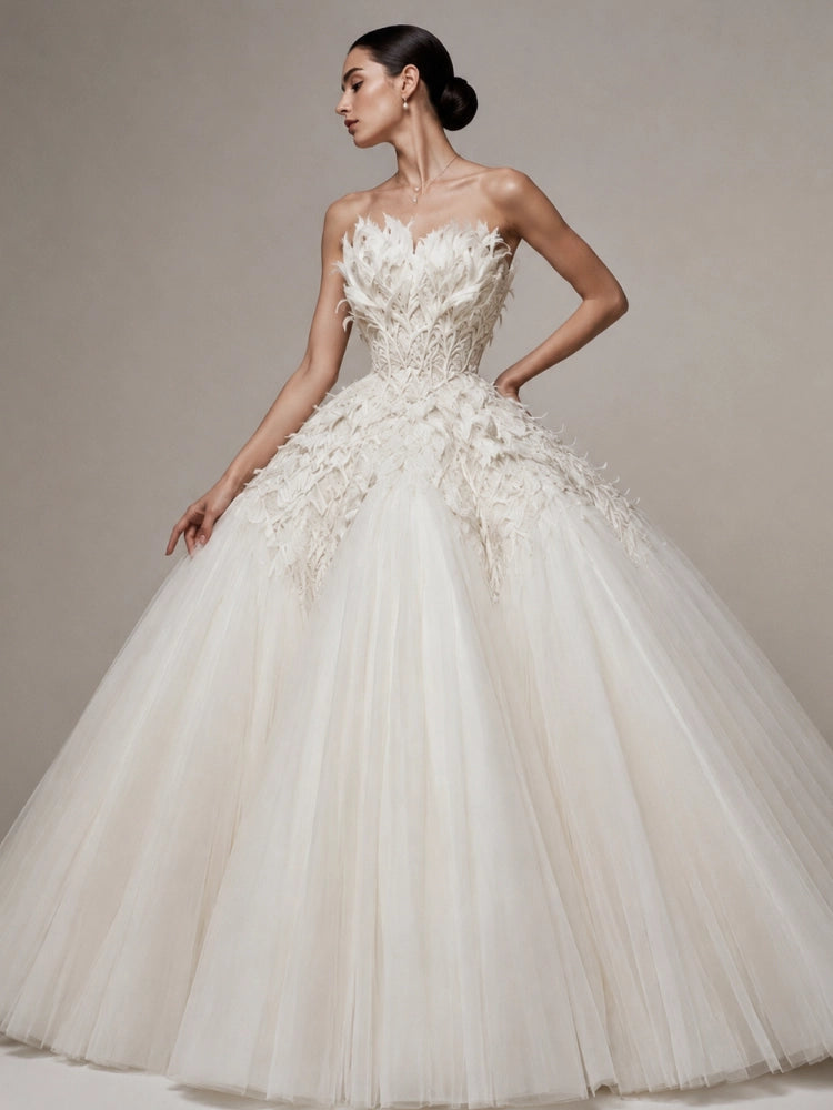 Luxury mobile homepage banner displaying a signature The Civilis pure white haute couture ballgown, showcasing a beautifully structured bodice adorned with delicate, hand-carved feather embroidery and a massive volumetric tulle skirt.